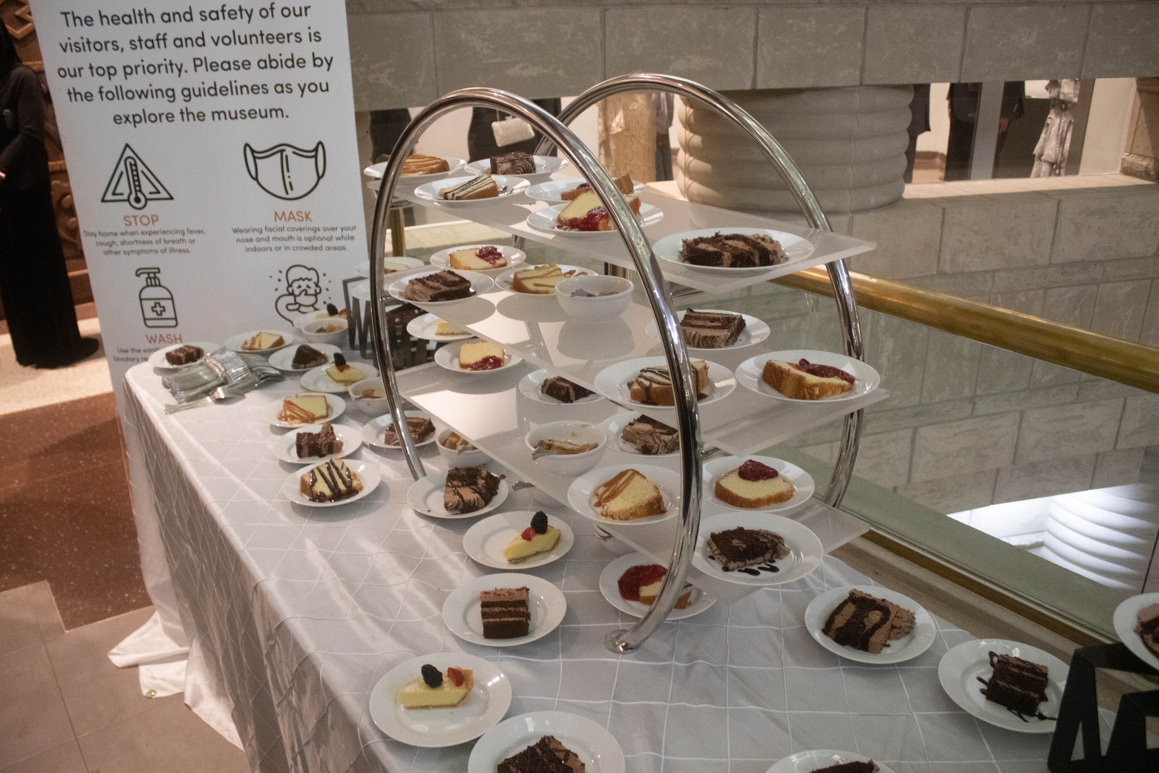Museum dessert display with safety guidelines sign