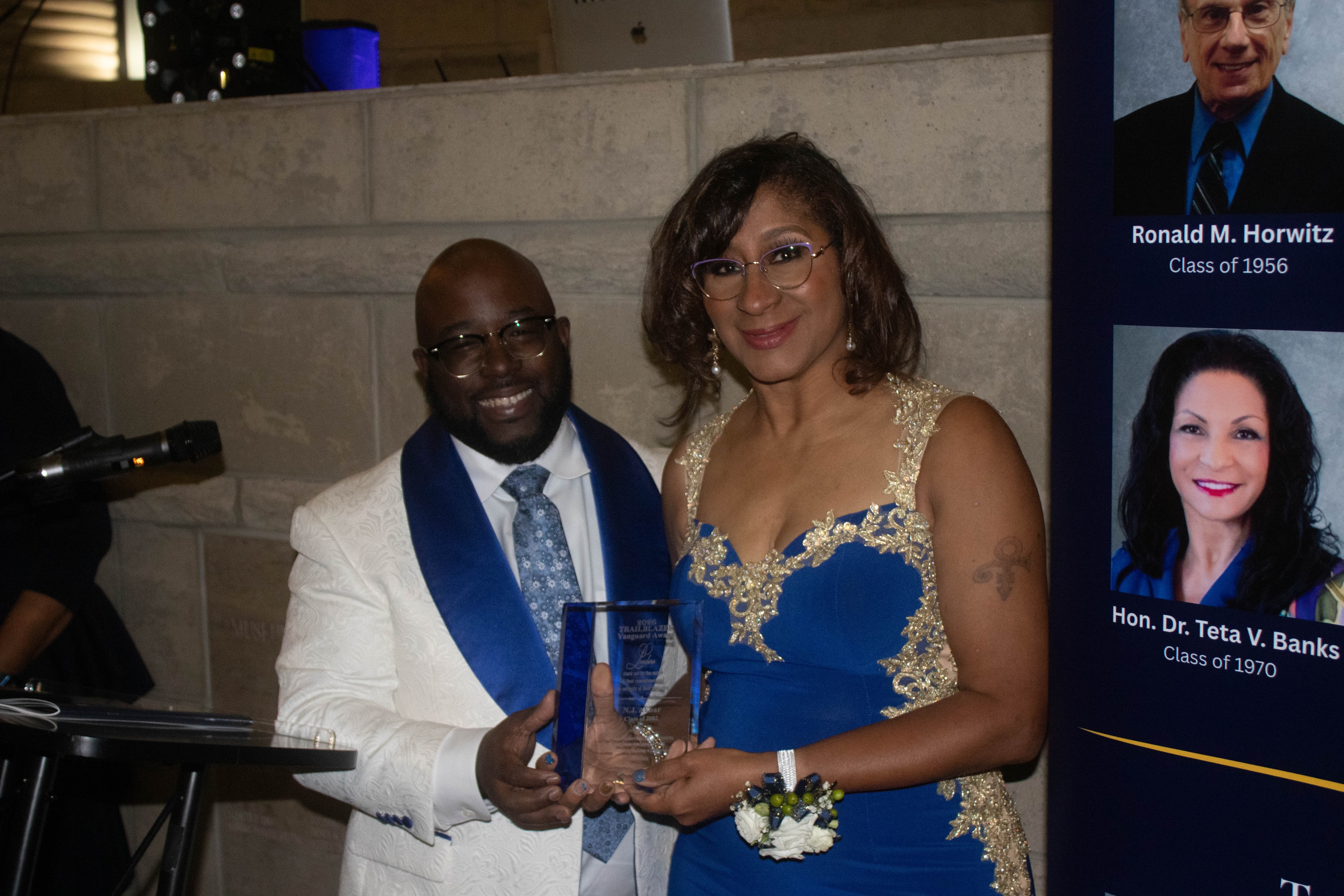 Woman receiving award at formal event